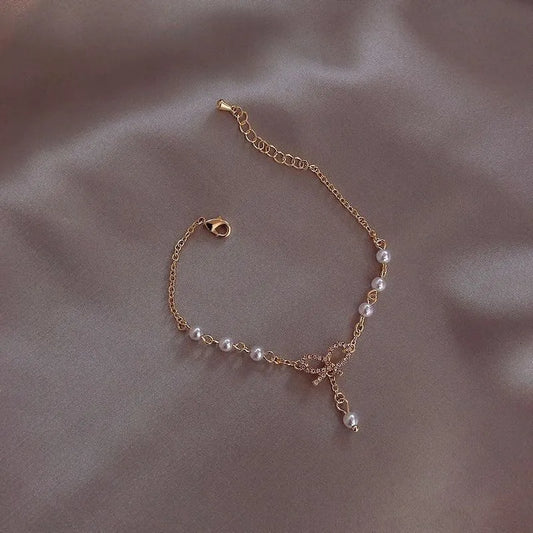 Bracelet chaîne et nœud en perles d'imitation