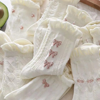 Élégance florale : chaussettes en coton avec joli nœud